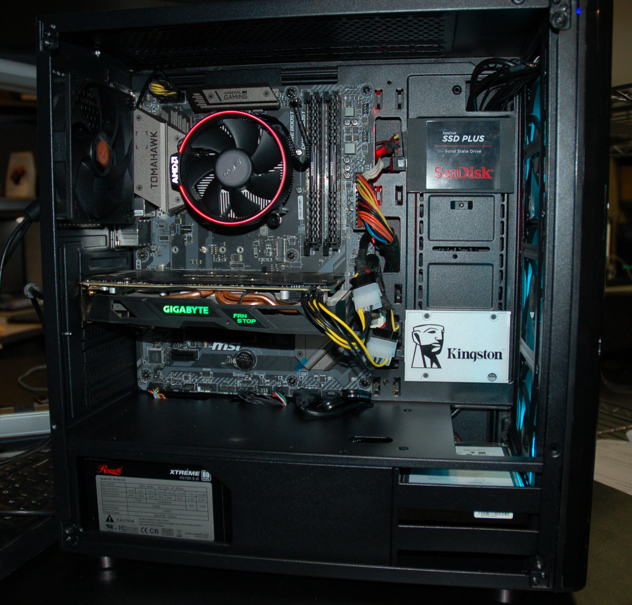 Hard drives, RAM, video card, and power supply installed.