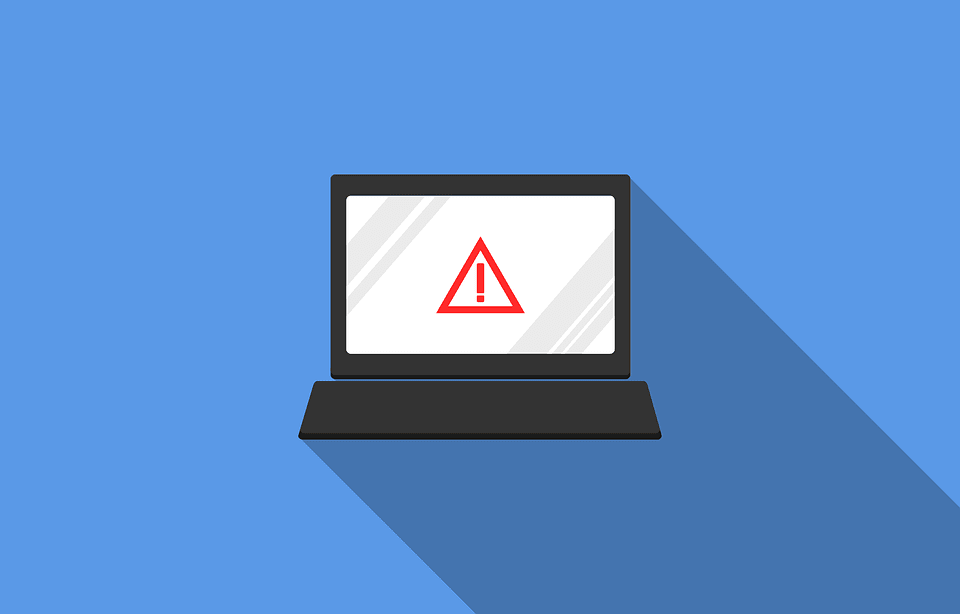 A laptop with a large warning icon